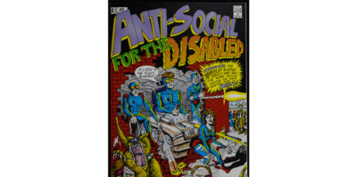 A photograph of the front cover of a comic book. In bold, purple, green and orange text it says, “Anti-Social for the Disabled”. The text, “Disabled” is larger with a curvy font. Beneath the title is a drawing of four middle-aged people in blue jumpsuits. They are busting through a red brick building in a car. The person in the center is wearing yellow-tinted glasses. On the bottom right, a wolf with large teeth has its jaw extended. The man on the right is shooting a laser.